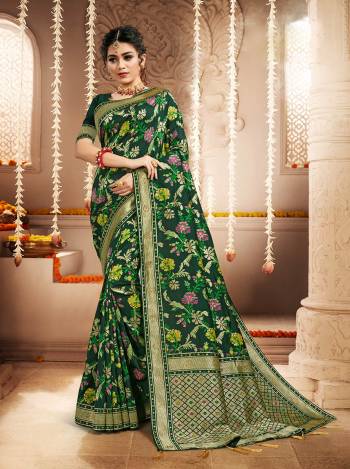 Attrective This Pretty Elegant Looking Designer Saree In Green Color Paired With Blouse. This Saree And Blouse Are Heavy Silk Based Beautified With Wevon Designer Work Saree. Buy Now.