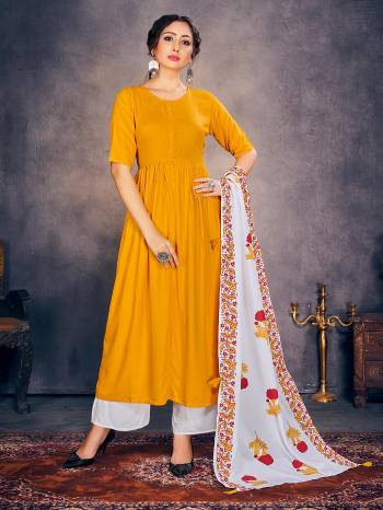 Garb This Designer Redymade Suit In Fine Light Color Paired With Dupatta. Its Designer Printed Top Is Fabricated On Rayon Paired With Rayon Bottom And Printed Rayon Dupatta. Buy this Suit Now.