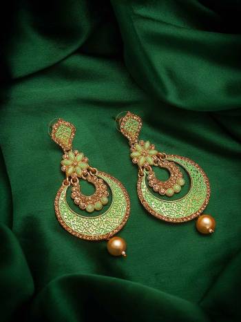 Give An Enhanced Look To Your Personality By Pairing Up This Beautiful Earring Set With Your Ethnic Attire. This Pretty Set Is In Green Color Beautified With American Diamond Work. Buy Now.