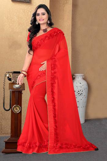 Celebrate This Festive Season And Party Wear In This Very Pretty Red Colored Designer Saree Paired With Blouse. This Saree Are Georgette and Blouse Are Banglori Silk Based Beautified With Detailed Floral,Ribbon Work. 