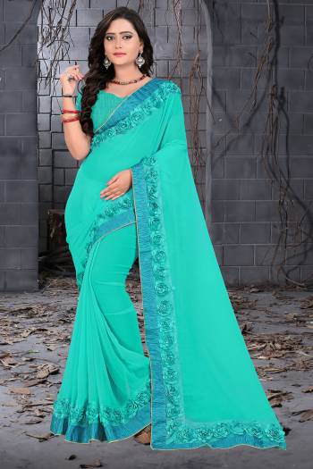 Celebrate This Festive Season And Party Wear In This Very Pretty Sky Blue Colored Designer Saree Paired With Blouse. This Saree Are Georgette and Blouse Are Banglori Silk Based Beautified With Detailed Floral,Ribbon Work. 