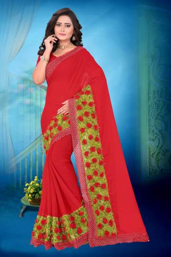 Celebrate This Festive Season And Party Wear In This Very Pretty Red Colored Designer Saree Paired With Blouse. This Saree Are Chiffon and Blouse Are Banglori Silk Based Beautified With Detailed Floral,Ribbon Grass Work. 