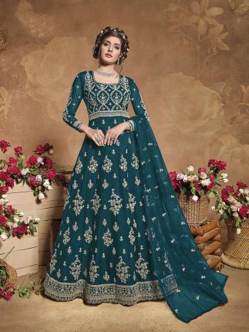 Get Ready For The Upcoming Wedding Season With This Attractive Looking Heavy Designer Floor Length Suit In Aqua Green Color. This Pretty Heavy Embroidered Suit Is Fabricated On Butterfly Net Paired With Satin Bottom And Butterfly Net Fabricated Dupatta. Its Bright Color And Heavy Embroidery Will Give An Attractive Look To Your Personality.