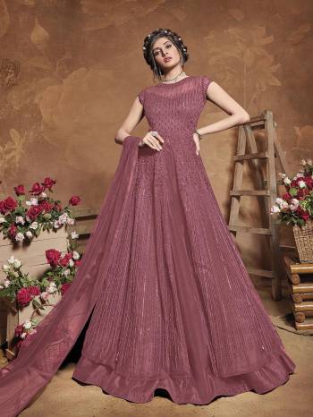 Get Ready For The Upcoming Wedding Season With This Attractive Looking Heavy Designer Floor Length Suit In Burgundy Color. This Pretty Heavy Embroidered Suit Is Fabricated On Butterfly Net Paired With Bangal Ore Silk Bottom And Butterfly Net Fabricated Dupatta. Its Bright Color And Heavy Embroidery Will Give An Attractive Look To Your Personality.