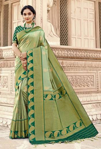 Rich Look This Pretty Elegant Looking Designer Party Wear Saree In Fine Light Color Paired With Blouse. This Saree Are Banarasi Silk And Blouse Are Banarasi Silk With Hand Wevon Designer Work Saree And Blouse Beautified Saree. Buy Now.