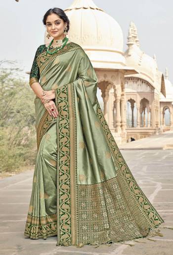 Rich Look This Pretty Elegant Looking Designer Party Wear Saree In Fine Light Color Paired With Blouse. This Saree Are Banarasi Silk And Blouse Are Banarasi Silk With Hand Wevon Designer Work Saree And Blouse Beautified Saree. Buy Now.