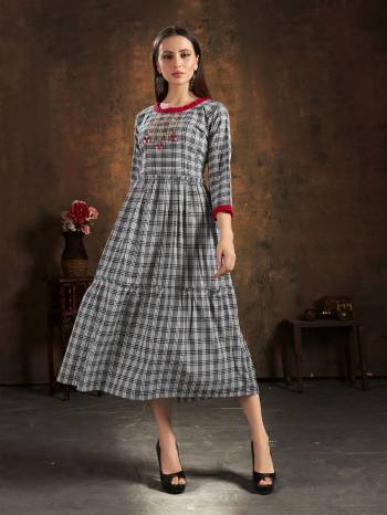 Grab This Readymade Long Kurti In Fine Color Fabricated On Cotton Wevon Chex Beautified With Hand Embroidery Work. It Is Light In Weight And Easy To Carry All Day Long. 