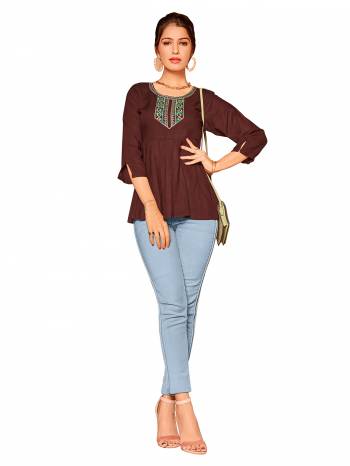 Look This Readymade Short Kurti In Fine Color Fabricated On Rayon Beautified With Hand Embroidery Work. It Is Light In Weight And Easy To Carry All Day Long. 