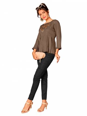 Look This Readymade Short Kurti In Fine Color Fabricated On Rayon Beautified With Hand Embroidery Work. It Is Light In Weight And Easy To Carry All Day Long. 