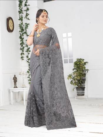 Adorn The Pretty Angelic Look Wearing This Party Wear Heavy Designer  Embroidery,Zarkan Stone Work Saree With Blouse. This Saree Is Fabricated On Net Paired With Blouse. Its Pretty Color Pallete Will Give An Attractive Look To Your Personality. 