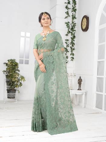 Adorn The Pretty Angelic Look Wearing This Party Wear Heavy Designer  Embroidery,Zarkan Stone Work Saree With Blouse. This Saree Is Fabricated On Net Paired With Blouse. Its Pretty Color Pallete Will Give An Attractive Look To Your Personality. 