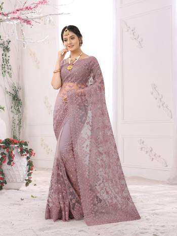 Adorn The Pretty Angelic Look Wearing This Party Wear Heavy Designer  Embroidery,Zarkan Stone Work Saree With Blouse. This Saree Is Fabricated On Net Paired With Blouse. Its Pretty Color Pallete Will Give An Attractive Look To Your Personality. 