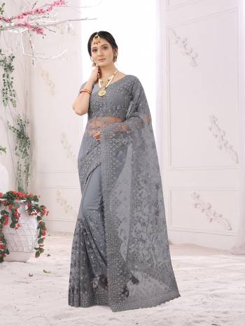 Adorn The Pretty Angelic Look Wearing This Party Wear Heavy Designer  Embroidery,Zarkan Stone Work Saree With Blouse. This Saree Is Fabricated On Net Paired With Blouse. Its Pretty Color Pallete Will Give An Attractive Look To Your Personality. 