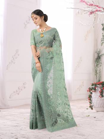 Adorn The Pretty Angelic Look Wearing This Party Wear Heavy Designer  Embroidery,Zarkan Stone Work Saree With Blouse. This Saree Is Fabricated On Net Paired With Blouse. Its Pretty Color Pallete Will Give An Attractive Look To Your Personality. 