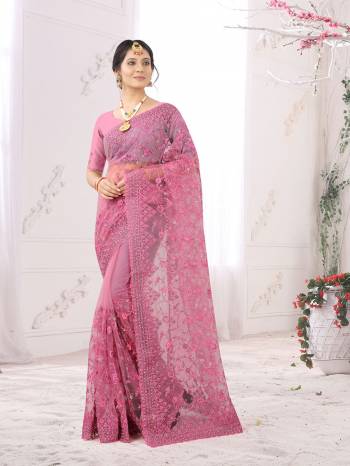 Adorn The Pretty Angelic Look Wearing This Party Wear Heavy Designer  Embroidery,Zarkan Stone Work Saree With Blouse. This Saree Is Fabricated On Net Paired With Blouse. Its Pretty Color Pallete Will Give An Attractive Look To Your Personality. 