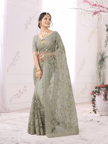 Adorn The Pretty Angelic Look Wearing This Party Wear Heavy Designer  Embroidery,Zarkan Stone Work Saree With Blouse. This Saree Is Fabricated On Net Paired With Blouse. Its Pretty Color Pallete Will Give An Attractive Look To Your Personality. 