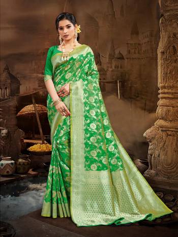 Celebrate This Festive Season And Partywear In This Very Pretty Green Colored Designer Saree Paired With Blouse. This Saree and Blouse Are Silk Based Beautified With Detailed Wevon Heavy Deasigner Work. 