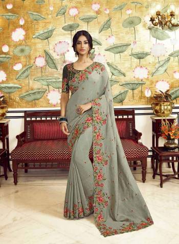 Look Attractive Wearing This Partywear Saree Are Fine Saree Paired With Contrasted Colored Blouse.  This Heavy Designer Embroidery Stone Work Saree Is Vichitra Silk Based And Blouse Are Dupion Fabric. Which Gives A Rich Look To Your Personality. Buy This Pretty Saree Now.