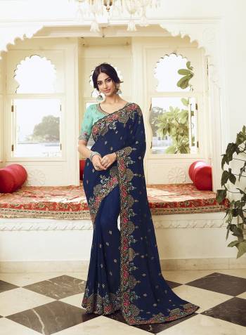 Look Attractive Wearing This Partywear Saree Are Fine Saree Paired With Contrasted Colored Blouse.  This Heavy Designer Embroidery Stone Work Saree Is Vichitra Silk Based And Blouse Are Dupion Fabric. Which Gives A Rich Look To Your Personality. Buy This Pretty Saree Now.