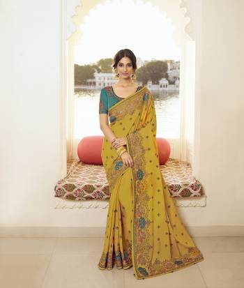 Look Attractive Wearing This Partywear Saree Are Fine Saree Paired With Contrasted Colored Blouse.  This Heavy Designer Embroidery Stone Work Saree Is Vichitra Silk Based And Blouse Are Dupion Fabric. Which Gives A Rich Look To Your Personality. Buy This Pretty Saree Now.