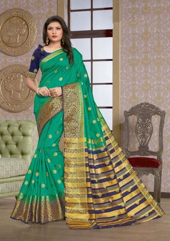 Grab This Pretty Elegant Looking Designer Saree In Dark Color Paired With Contrasting Colored Blouse. This Saree And Blouse Are Silk Based Beautified With Wevon Jari Designer Work. Buy Now.