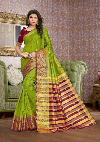 Grab This Pretty Elegant Looking Designer Saree In Dark Color Paired With Contrasting Colored Blouse. This Saree And Blouse Are Silk Based Beautified With Wevon Jari Designer Work. Buy Now.