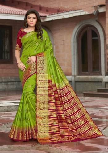 Grab This Pretty Elegant Looking Designer Saree In Dark Color Paired With Contrasting Colored Blouse. This Saree And Blouse Are Silk Based Beautified With Wevon Jari Designer Work. Buy Now.