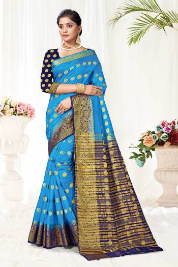 Attrective This Pretty Elegant Looking Designer Saree In Dark Color Paired With Contrasting Colored Blouse. This Saree And Blouse Are Silk Based Beautified With Wevon Jari Designer Work. Buy Now.