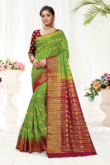 Attrective This Pretty Elegant Looking Designer Saree In Dark Color Paired With Contrasting Colored Blouse. This Saree And Blouse Are Silk Based Beautified With Wevon Jari Designer Work. Buy Now.