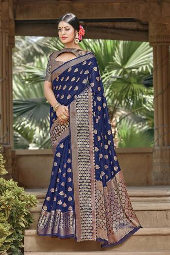 Garb This Pretty Angelic Look Wearing This Heavy Designer Saree In Dark Color Paired With Blouse. This Saree And Blouse Is Fabricated On Handloom Cotton. Its Pretty Color Pallete Will Give An Attractive Look To Your Personality. 