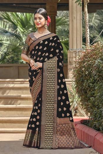 Garb This Pretty Angelic Look Wearing This Heavy Designer Saree In Dark Color Paired With Blouse. This Saree And Blouse Is Fabricated On Handloom Cotton. Its Pretty Color Pallete Will Give An Attractive Look To Your Personality. 