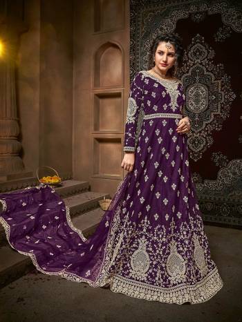 Atrective This Designer Long Length Suit In Fine Dark Color.?Its Pretty Heavy Designer Embroidery And Stone Work Top Is Net Based Paired With Net Bottom And Net Fabricated Dupatta Which Gives An Attractive To The Suit.