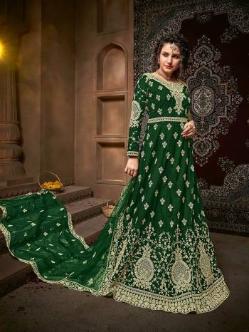 Atrective This Designer Long Length Suit In Fine Dark Color.?Its Pretty Heavy Designer Embroidery And Stone Work Top Is Net Based Paired With Net Bottom And Net Fabricated Dupatta Which Gives An Attractive To The Suit.
