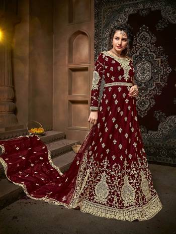 Atrective This Designer Long Length Suit In Fine Dark Color.?Its Pretty Heavy Designer Embroidery And Stone Work Top Is Net Based Paired With Net Bottom And Net Fabricated Dupatta Which Gives An Attractive To The Suit.