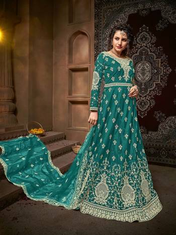 Atrective This Designer Long Length Suit In Fine Dark Color.?Its Pretty Heavy Designer Embroidery And Stone Work Top Is Net Based Paired With Net Bottom And Net Fabricated Dupatta Which Gives An Attractive To The Suit.
