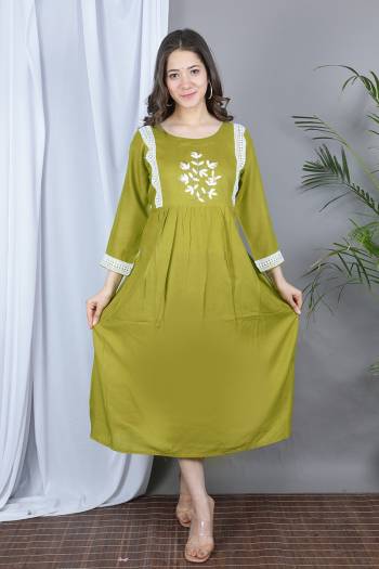 Grab This Designer Readymade Long Kurti In Fine Color Fabricated On Rayon. It Is Beautified With Designer Hand Work With Lace Work And You Can Pair This Up For A Festive Look. Buy Now.