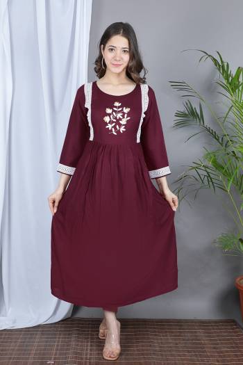 Grab This Designer Readymade Long Kurti In Fine Color Fabricated On Rayon. It Is Beautified With Designer Hand Work With Lace Work And You Can Pair This Up For A Festive Look. Buy Now.