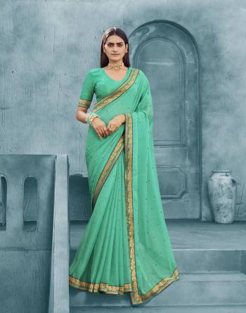 Adorn The Pretty Angelic Look Wearing This Heavy Swaroski Work Designer Saree In Fine Color Paired With Matching Blouse. This Saree Is Fabricated On Chiffon Paired With Broket Fabricated Blouse. Its Pretty Color Pallete Will Give An Attractive Look To Your Personality. 