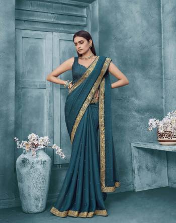 Adorn The Pretty Angelic Look Wearing This Heavy Swaroski Work Designer Saree In Fine Color Paired With Matching Blouse. This Saree Is Fabricated On Chiffon Paired With Broket Fabricated Blouse. Its Pretty Color Pallete Will Give An Attractive Look To Your Personality. 