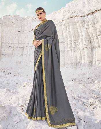 Garb This Pretty Angelic Look Wearing This Heavy Designer Swaroski Work Saree In Dark Color Paired With Matching Blouse. This Saree Is Fabricated On Vichitra Silk Paired With Broket Fabricated Blouse. Its Pretty Color Pallete Will Give An Attractive Look To Your Personality. 