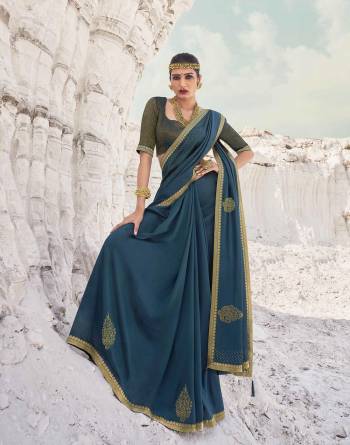 Garb This Pretty Angelic Look Wearing This Heavy Designer Swaroski Work Saree In Dark Color Paired With Matching Blouse. This Saree Is Fabricated On Vichitra Silk Paired With Broket Fabricated Blouse. Its Pretty Color Pallete Will Give An Attractive Look To Your Personality. 