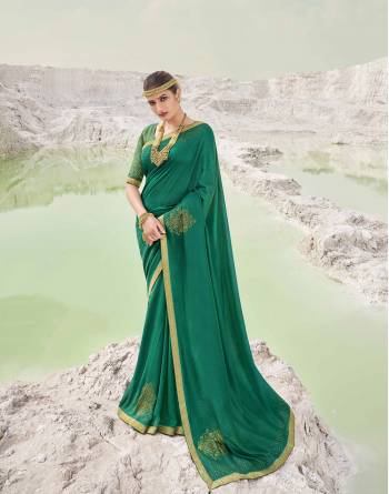 Garb This Pretty Angelic Look Wearing This Heavy Designer Swaroski Work Saree In Dark Color Paired With Matching Blouse. This Saree Is Fabricated On Vichitra Silk Paired With Broket Fabricated Blouse. Its Pretty Color Pallete Will Give An Attractive Look To Your Personality. 