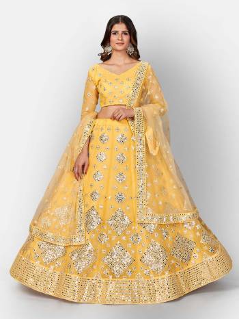 Attrective Look  Heavy Designer Bridal Lehenga Choli In Fine Color. This Heavy Embroidered Lehenga Choli Is  Organza Based Paired With Soft Net Fabricated Dupatta, It Is Beautified With Lovely Detailed Multy Thread Foil Miror Embroidery Work Giving An Attractive Look.