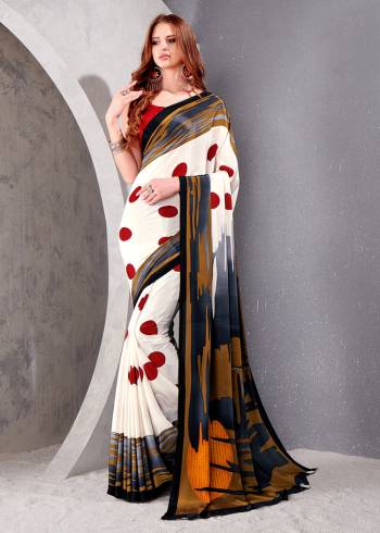 Garb This Party Wear Saree Are Fine Saree Paired With Matching Blouse.This Heavy Designer Printed Saree Is Crepe Silk Based And Blouse Are Crepe Silk Fabric. Which Gives A Rich Look To Your Personality. Buy This Pretty Saree Now.