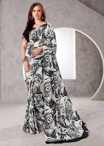 Garb This Party Wear Saree Are Fine Saree Paired With Matching Blouse.This Heavy Designer Printed Saree Is Crepe Silk Based And Blouse Are Crepe Silk Fabric. Which Gives A Rich Look To Your Personality. Buy This Pretty Saree Now.