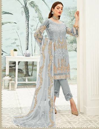 Garb This Designer Long Length Pakistani Suit In Lovely Light Color.?Its Pretty Heavy Designer Embroidred Work Top Is Grorgette Based Paired With Santoon Bottom And Soft Net Fabricated Dupatta Which Gives An Attractive To The Suit.