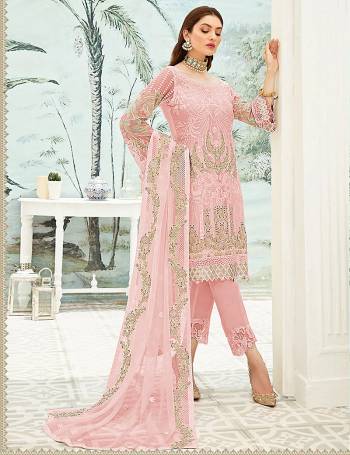 Garb This Designer Long Length Pakistani Suit In Lovely Light Color.?Its Pretty Heavy Designer Embroidred Work Top Is Grorgette Based Paired With Santoon Bottom And Soft Net Fabricated Dupatta Which Gives An Attractive To The Suit.