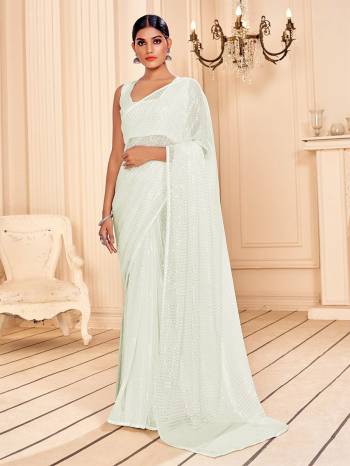 Garb This Party Wear Saree Are Fine Saree Paired With Matching Blouse.This Heavy Designer Sequance Embroidery Work Saree Is Faux Georgette Based And Blouse Are Art Silk Fabric. Which Gives A Rich Look To Your Personality. Buy This Pretty Saree Now.