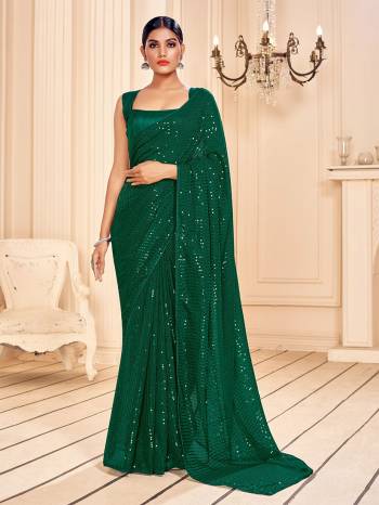 Garb This Party Wear Saree Are Fine Saree Paired With Matching Blouse.This Heavy Designer Sequance Embroidery Work Saree Is Faux Georgette Based And Blouse Are Art Silk Fabric. Which Gives A Rich Look To Your Personality. Buy This Pretty Saree Now.