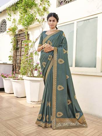 Garb This Party Wear Saree Are Fine Saree Paired With Matching Blouse.This Heavy Designer Work And Dianond Work Saree Is Dola Silk And Blouse Fabric. Which Gives A Rich LookTo Your Personality. Buy This Pretty Saree Now.